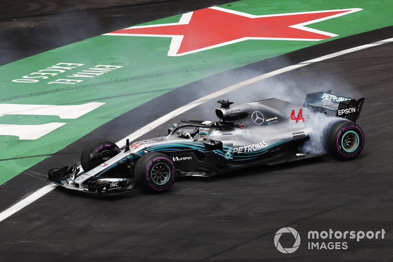 Lewis Hamilton, Mercedes AMG F1 W09 EQ Power+, performs a doughnut as he celebrates winning his fifth World Championship