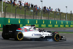 Jenson Button, McLaren MP4-31 and Felipe Massa, Williams FW38 battle for position