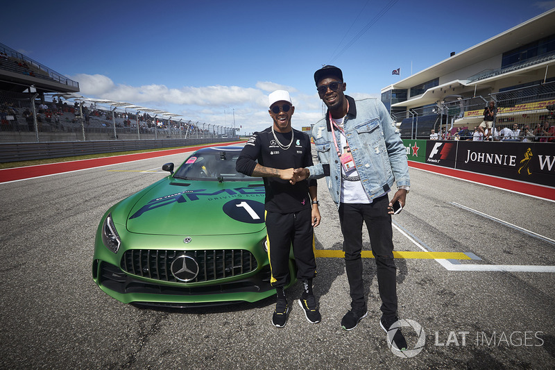 Usain Bolt is taken for a drive by Lewis Hamilton, Mercedes AMG F1