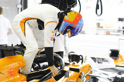 Fernando Alonso, McLaren, climbs into his cockpit