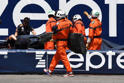 Marshals recover the crashed car of Max Verstappen, Red Bull Racing RB14