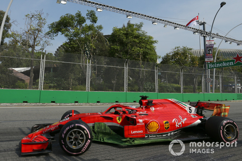 Pintura sobre el monoplaza de Sebastian Vettel