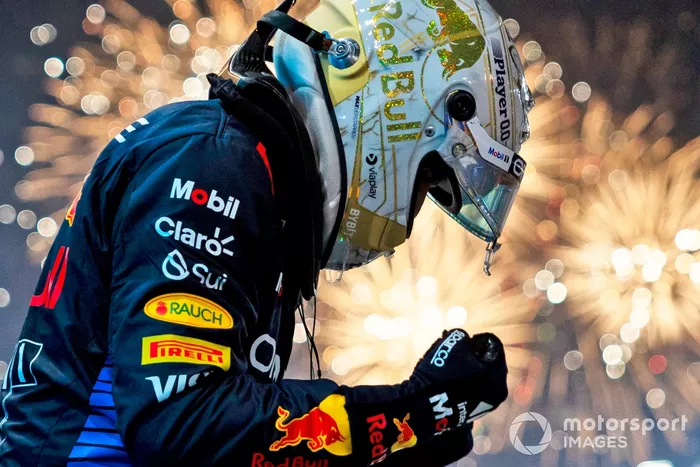 Fireworks light the sky as Max Verstappen, Red Bull Racing RB20, 1st position, celebrates on arrival in Parc Ferme