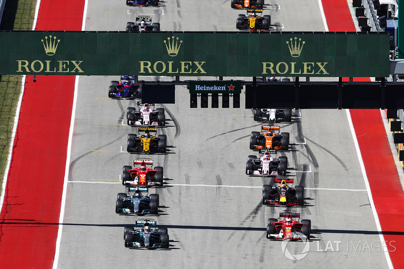 Lewis Hamilton, Mercedes AMG F1 W08, Sebastian Vettel, Ferrari SF70H, lead at the start of the race