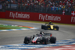 Romain Grosjean, Haas F1 Team VF-18, leads Carlos Sainz Jr., Renault Sport F1 Team R.S. 18