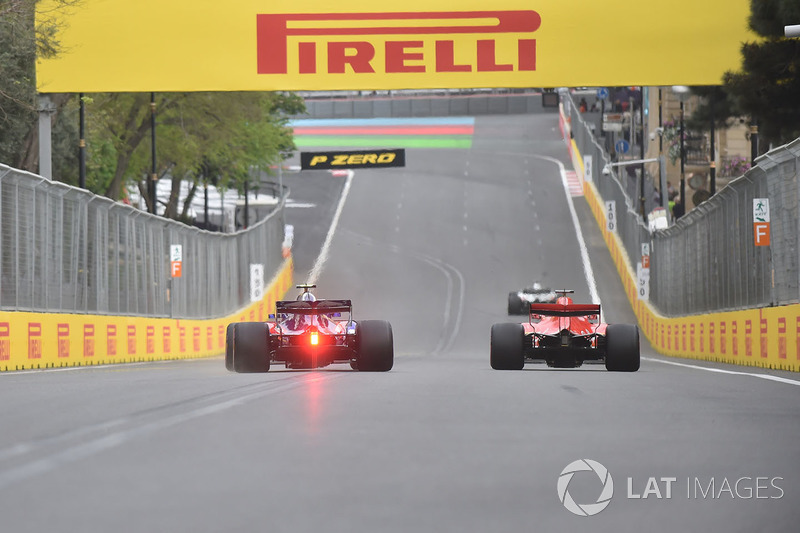 Sebastian Vettel, Ferrari SF71H and Pierre Gasly, Scuderia Toro Rosso STR13