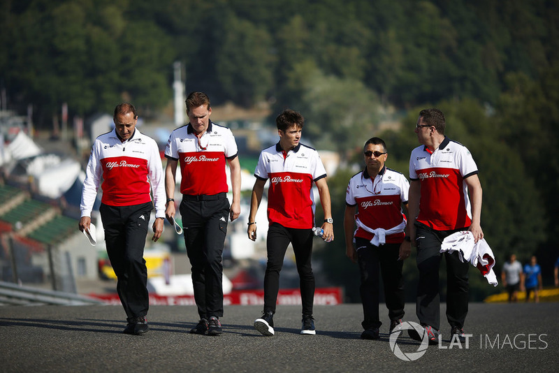 Charles Leclerc, Sauber, walks the circuit with colleagues
