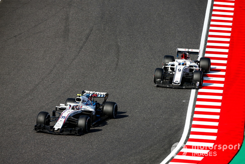 Sergey Sirotkin, Williams FW41, leads Marcus Ericsson, Sauber C37