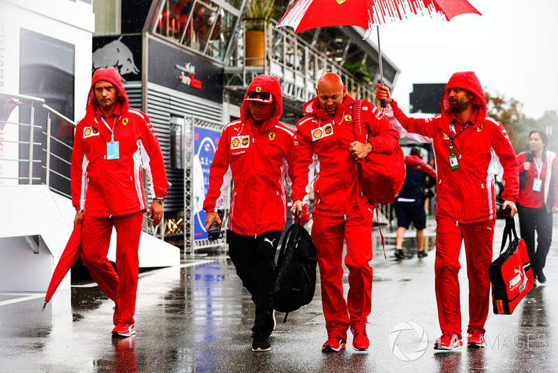 Kimi Raikkonen, Ferrari, arrives in the paddock