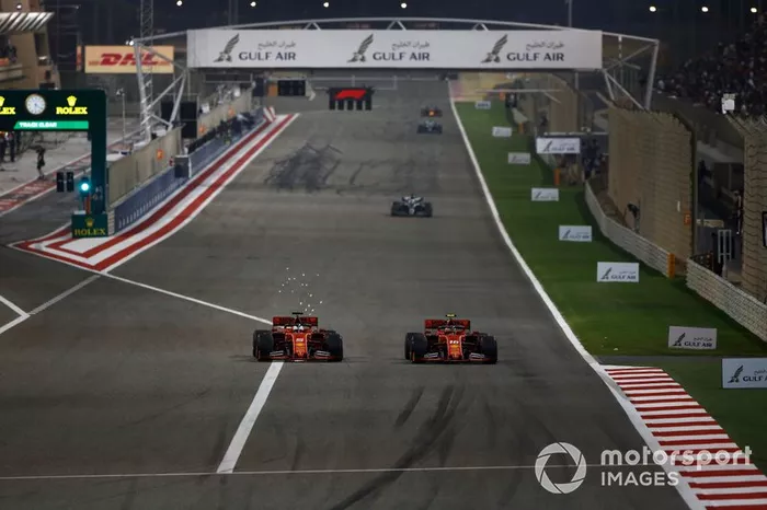 Sebastian Vettel, Ferrari SF90, battles with Charles Leclerc, Ferrari SF90