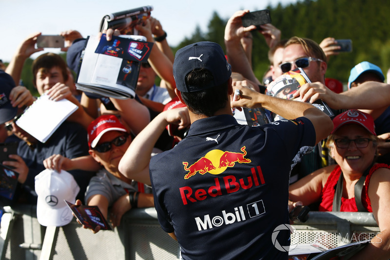 Daniel Ricciardo, Red Bull Racing, signs autographs for fans