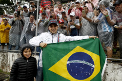 Felipe Massa, Williams, and son Felipinho, with fans and the Brazilian flag