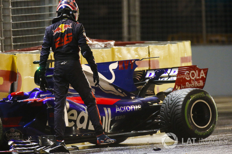 Daniil Kvyat, Scuderia Toro Rosso, climbs out of his car after crashing out