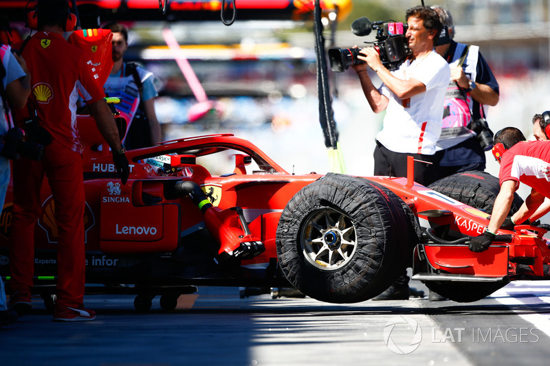 Kimi Raikkonen, Ferrari SF71H, is returned to the garage