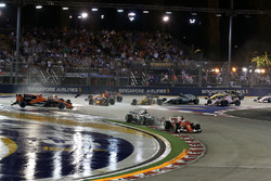 Sebastian Vettel, Ferrari SF70H leads at the start of the race as Fernando Alonso, McLaren MCL32, Ki