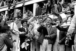 Podium: winners A.J. Foyt, Dan Gurney, second place Ludovico Scarfiotti, Mike Parks. This was the first time champagne was sprayed in celebration on a podium.