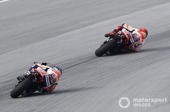 Marc Marquez, Repsol Honda Team about to crash in front of Alex Marquez, Repsol Honda Team