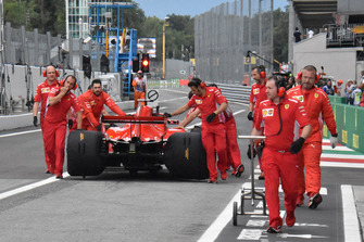 Sebastian Vettel pushed through pitlane