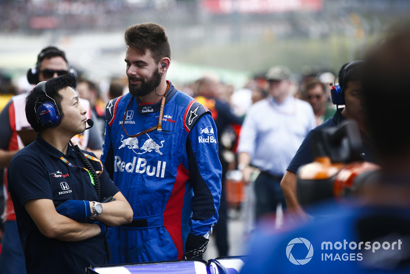 Toro Rosso Honda team members talk on the grid