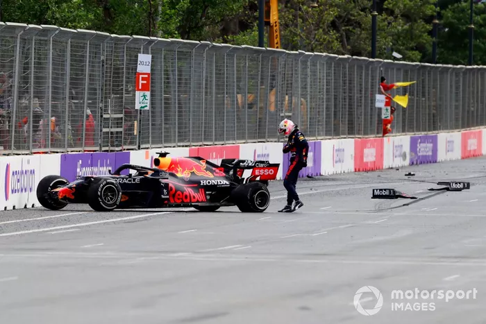 Max Verstappen, Red Bull Racing RB16B, kicks his car after crashing out