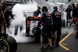 The brakes of Max Verstappen, Red Bull Racing RB12, catch fire in the pits