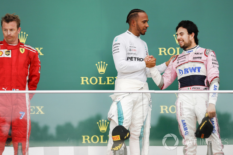 Kimi Raikkonen, Ferrari, 2nd position, Lewis Hamilton, Mercedes AMG F1, 1st position, and Sergio Perez, Force India, 3rd position, on the podium