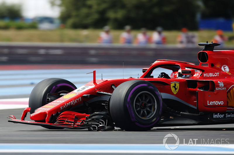 Sebastian Vettel, Ferrari SF71H, returns to the pits with a broken front wing