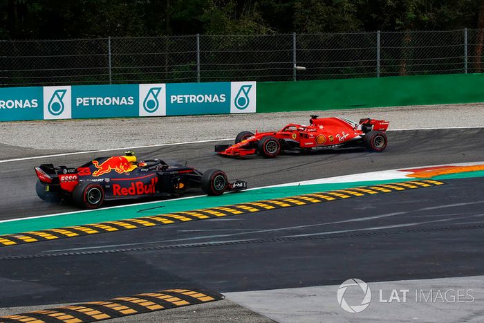 Sebastian Vettel, Ferrari SF71H trompea tras tocarse con Lewis Hamilton, Mercedes AMG F1 W09 en la primera vuelta del GP de Italia
