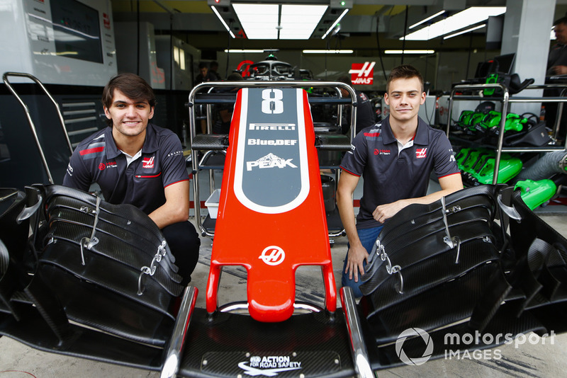 Haas test and development drivers Pietro Fittipaldi and Louis Deletraz pose with a front wing and nose cone