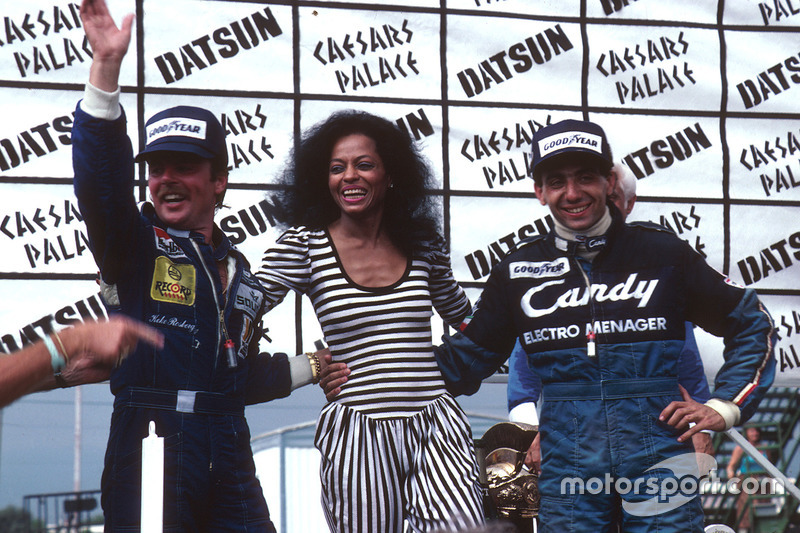 Podium: race winner Michele Alboreto, Tyrell Ford, second place and World Champion Keke Rosberg, Wil