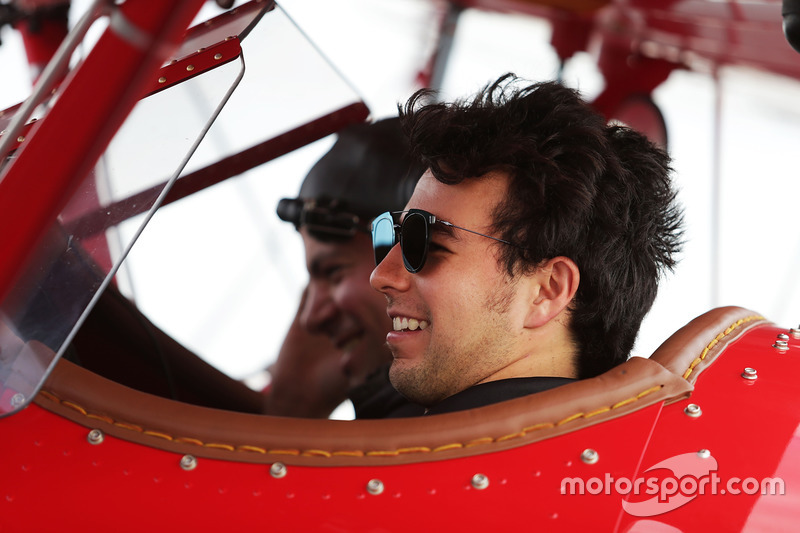 Sergio Perez, Sahara Force India F1 takes a flight in a biplane