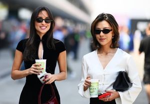 Alexandra Saint Mleux and Lily Muni He walk in the Paddock 