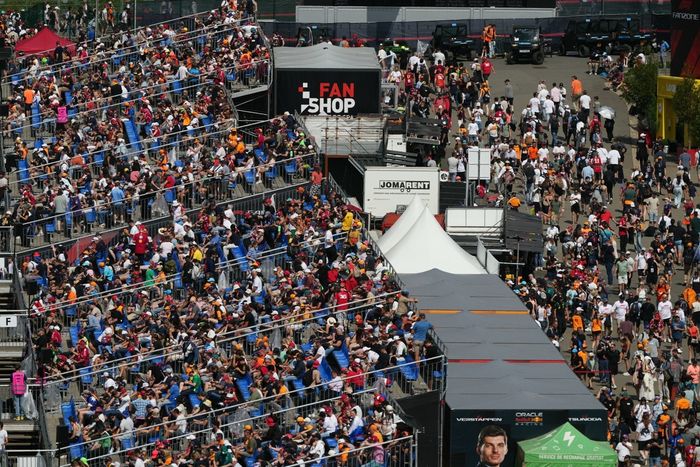 Spectators sit on the stands 