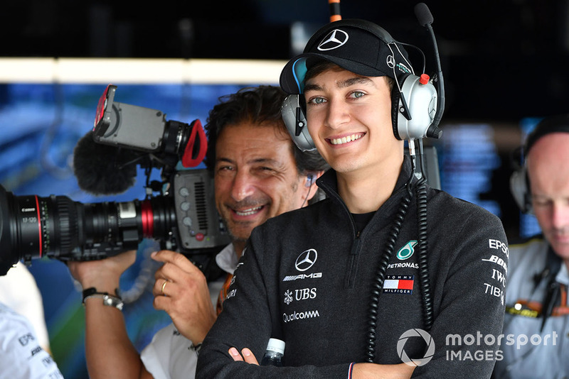 George Russell, Mercedes AMG F1 and Jean-Michel Tibi, FOM Cameraman