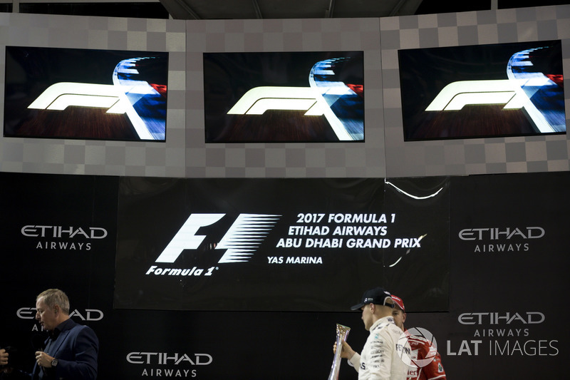 Podium: Race winner Valtteri Bottas, Mercedes AMG F1 with the new F1 logos above