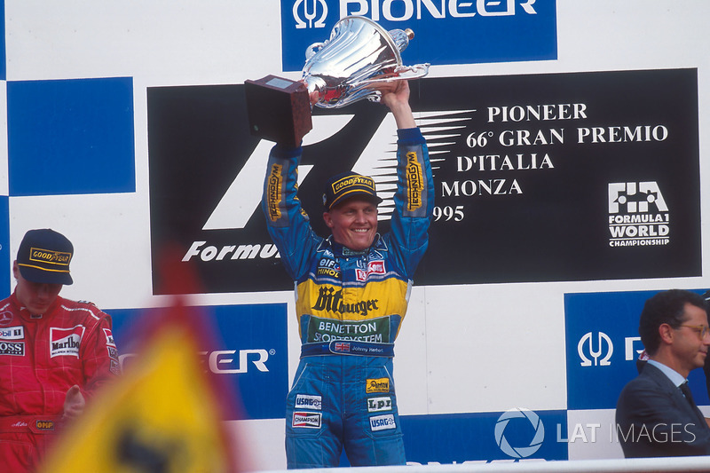 Johnny Herbert celebrates 1st position on the podium