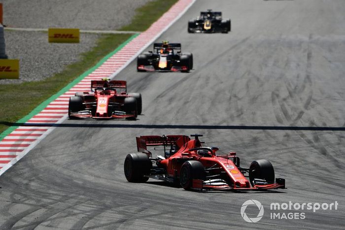 Sebastian Vettel, Ferrari SF90, leads Charles Leclerc, Ferrari SF90, and Pierre Gasly, Red Bull Racing RB15