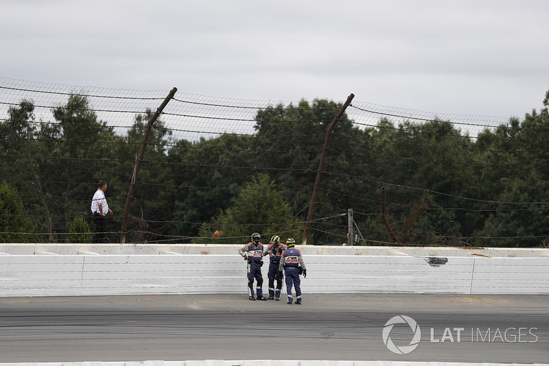 IndyCar officials at the site of the crash