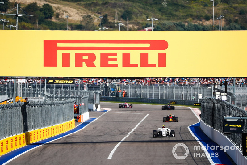 Charles Leclerc, Sauber C37, leads Max Verstappen, Red Bull Racing RB14