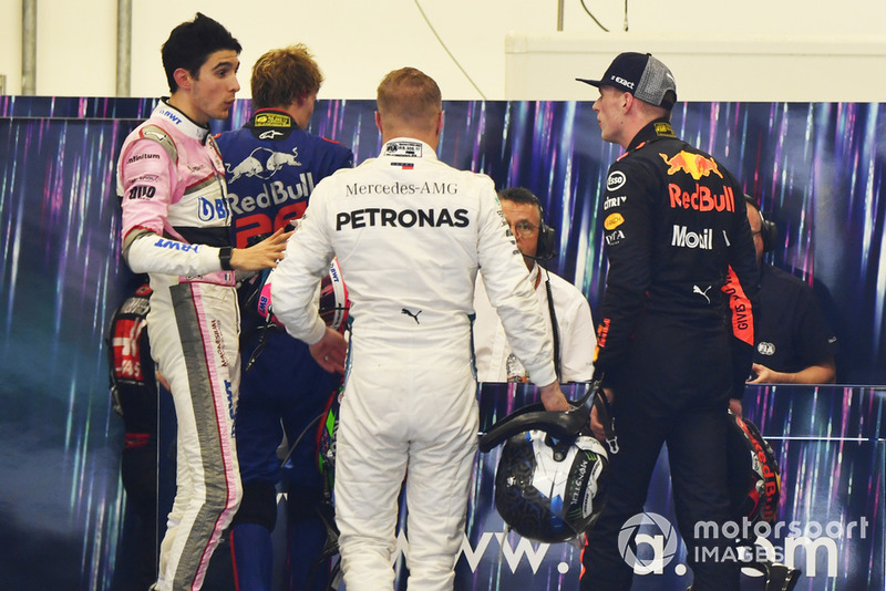 Max Verstappen, Red Bull Racing and Esteban Ocon, Racing Point Force India square up after the race following their on track crash 