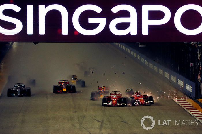 Sebastian Vettel, Ferrari SF70H leads at the start of the race and the cars of Kimi Raikkonen, Ferrari SF70H and Max Verstappen, Red Bull Racing RB13 crash after colliding