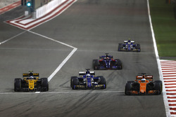 Fernando Alonso, McLaren MCL32, leads Marcus Ericsson, Sauber C36, and Jolyon Palmer, Renault Sport F1 Team RS17