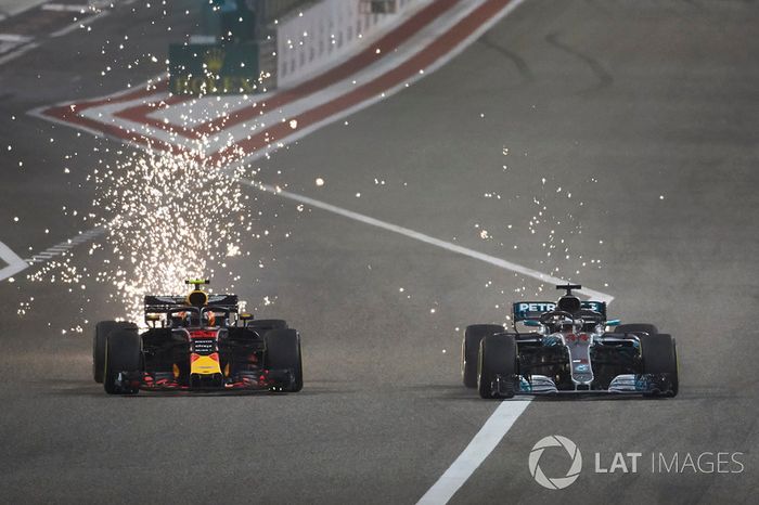 Sparks fly as Max Verstappen, Red Bull Racing RB14 Tag Heuer, battles with Lewis Hamilton, Mercedes AMG F1 W09