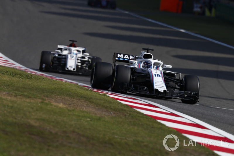 Lance Stroll, Williams FW41 Mercedes, Marcus Ericsson, Sauber C37 Ferrari