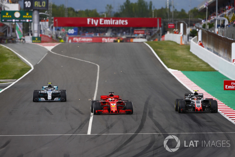 Kevin Magnussen, Haas F1 Team VF-18, Sebastian Vettel, Ferrari SF71H and Valtteri Bottas, Mercedes AMG F1 W09