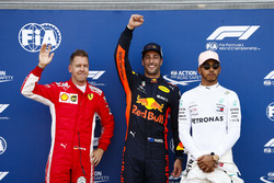 Daniel Ricciardo, Red Bull Racing, celebrates pole position between Sebastian Vettel, Ferrari, and Lewis Hamilton, Mercedes AMG F1