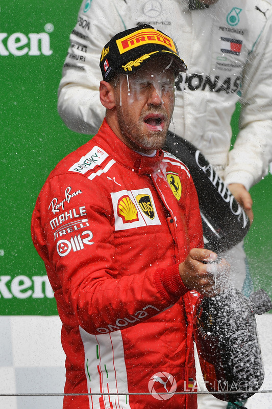 Race winner Sebastian Vettel, Ferrari celebrates on the podium with the chmpagne
