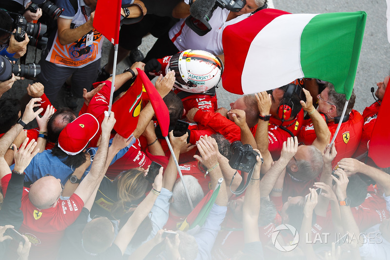 Sebastian Vettel, Ferrari, celebrates victory in parc ferme with his team