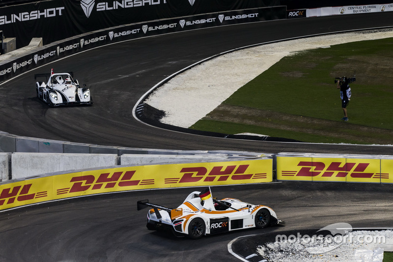 Sebastian Vettel, rounds the corner ahead of Tom Kristensen, driving the the Radical SR3 RSX