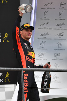 Lewis Hamilton, Mercedes AMG F1 and Max Verstappen, Red Bull Racing celebrate on the podium with the trophies